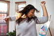 © peopleimages.com - Happy, woman and dancing with fun at house for freedom, energy and music of good news celebration. Excited, female person and disco time in living room for morning routine, movement and entertainment