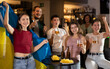 © JackF - Group of fans of Ukrainian team with a flag are watching the match on TV in a beer bar. They are worried and supporting their favorite team