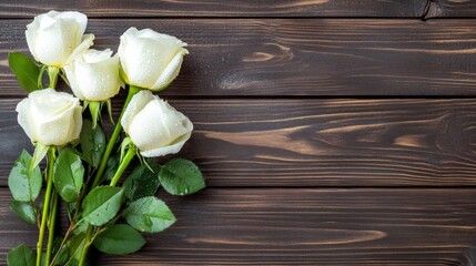 Poster - A bouquet of white roses with glistening water droplets, placed on a dark wooden surface for an elegant and classic feel