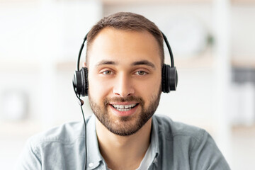 Poster - Cheerful male freelancer in headphones having online video call, speaking to business partner, participating in web conference or remote meeting, computer screen view