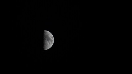 Wall Mural - half moon in the black night sky.