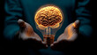 © Muh Saleh - Glowing brain in lightbulb, hands, dark background
