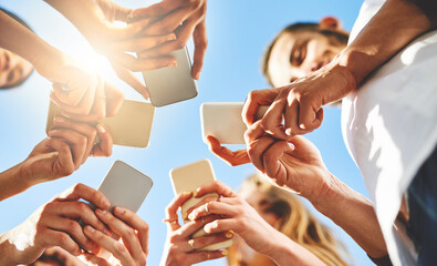 Aufkleber - People, hands and below with phone for communication, data sync or network under blue sky. Low angle, closeup or group with mobile smartphone for connectivity, social media or global software app