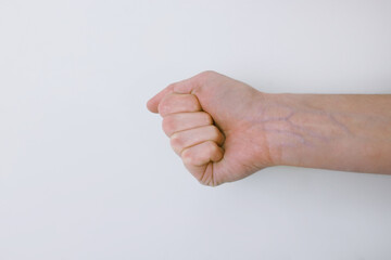 Wall Mural - Woman with visible hand veins on white background, closeup