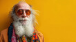 © Liana - Eccentric older man with a long white beard and colorful scarf poses against a vibrant yellow background