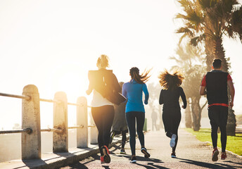 Poster - People, back and running with fitness on promenade for cardio workout or exercise together by beach. Friends, active team or group of runners in race for sprint or marathon on sidewalk by ocean coast