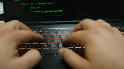 close-up of a computer screen and a man writing code. cybersecurity, the concept of data security.