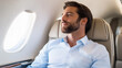 © InspirationDesign - Mediterranean entrepreneur relaxing in private jet cabin. Represents luxury travel, executive transport, and high-end business lifestyle.