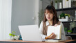 © Wanda - Asian student woman online learning from home