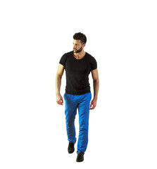 Poster - Man int-shirt and blue pants walking confidently, isolated on white background. Concept of casual fashion and confident attitude