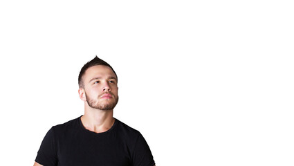 Poster - A young man in ashirt looking upward isolated on a white background. Close-up portrait of thoughtful or curious expression, concept of contemplation