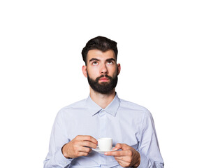 Fototapete - Bearded man in a light shirt holding a small coffee cup, looking upwards. Isolated on a white background. Concept of contemplation or ideas