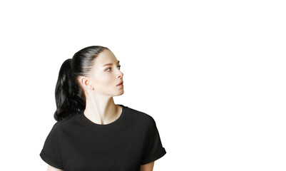 Poster - A young woman with sleekhair in a ponytail wearing ashirt, looking to the side. Isolated on a white background, design template