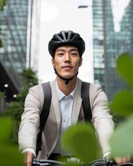 Poster - Sleek Urban Commuter Young Korean Man on Black Bicycle in Greenery-Filled Bike Lane - Modern Sustainable Travel and Professional City Mobility Solutions