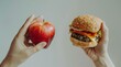 © Michela - Contrasto tra cibi sani e non sani, suggerendo una riflessione sulle scelte alimentari tra una mela sana e un hamburger calorico di pane al sesamo, carne, formaggio e pomodoro.