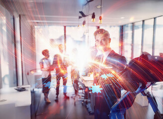 Aufkleber - Abstract sci-fi double exposure image. A businessman interacts with glowing network gears in a modern office, his team blurred in the background.