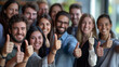 © Viorel Sima - successful team of men and women working together and showing thumb finger