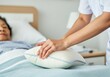© Anna - Nurse adjusting pillow for elderly patient in hospital bed showing compassionate care