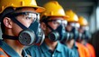 © Vadym - Workers wearing safety gear receiving training on respiratory protection. Wearing respirators, safety glasses, hard hats. Focus on safety clear in photo. Training session on respirator fit testing,