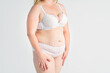 © staras - Fat woman in white underwear on gray background, overweight female, obesity body, weight loss concept