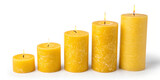 A Collection of Yellow Candles from Small to Tall Isolated on a White Background, Perfect for Home Decor