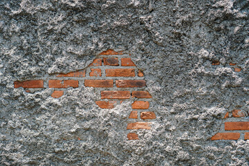 Poster - Close-up of an old wall with exposed brick and crumbling plaster. The texture is rough and aged. Weathered Brick and Plaster Wall Texture Sharp Detail background.