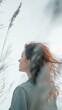 © Kittichet - Woman with long hair standing outdoors in natural light with a serene expression on her face
