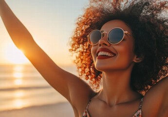 Wall Mural - A woman with curly hair is smiling and wearing sunglasses