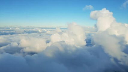 Wall Mural - Gliding through dense clouds at high altitude, the immersive pilot POV showcases the beauty of flying over and through a white cloud on a radiant and sunny day. Generative AI.