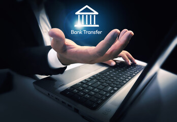 Poster - Bank transfer or digital banking concept background with glowing shape in a hand along laptop in the backdrop. Modern banking backdrop