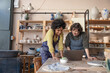 © ReeldealHD images - Two women starting a craft business looking at a laptop computer