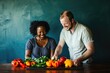 © Anjali - A happy couple prepares colorful bell peppers and herbs together in a kitchen setting.