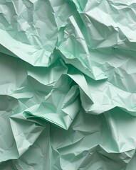 Poster - Pale mint crumpled paper with uneven folds and a soothing gentle look abstract background