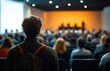 © btiger - Dynamic Speaker Engaging Conference Audience in Modern Setting with De-focused Presentation Background