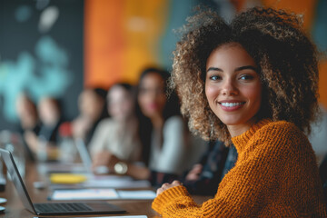 Wall Mural - Woman with curly hair smiling and looking at the camera in a bright outdoor setting with natural light and greenery in the background