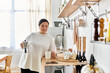 © Bliss - A young woman brews coffee in a cozy kitchen, savoring a peaceful moment of relaxation.