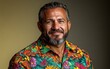 © hakule - A man with a mustache and a floral shirt is smiling