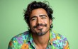 © hakule - A man with a mustache and a floral shirt is smiling