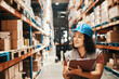 © Davor - Female warehouse worker inspecting inventory with clipboard