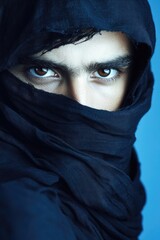 Aufkleber - A close-up shot of someone wearing a black scarf