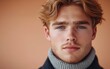 © hakule - A man with a beard and blue eyes is wearing a gray sweater