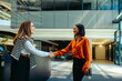 © Jacob Lund - Two professional women greet each other with a handshake on the first day as a tax advisor