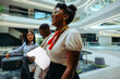 © Jacob Lund - Friendly African businesswoman with colleagues in modern office lobby
