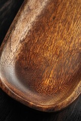 Poster - Close-up shot of a wooden plate on a table with intricate designs and texture