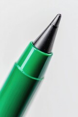 Poster - A close-up view of a green pen resting on a white surface, ideal for use in illustrations and designs