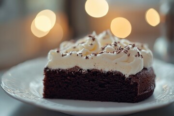 Poster - A slice of rich and moist chocolate cake on a clean white plate, perfect for desserts or snacks