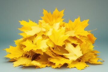 Poster - A pile of yellow leaves sitting on top of a table, perfect for fall-themed designs and compositions