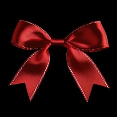 Poster - A single red bow sitting on a dark or black background
