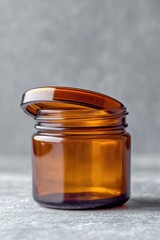 Poster - A brown glass jar with a lid sits on a table, ready for use