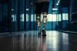 © Dmitry Rukhlenko - Amputee sportsman walking in corridor with bionic prosthetic legs prosthesis with robotic technology. Advancements in medical science and engineering, determination, strength, progress of the disabled